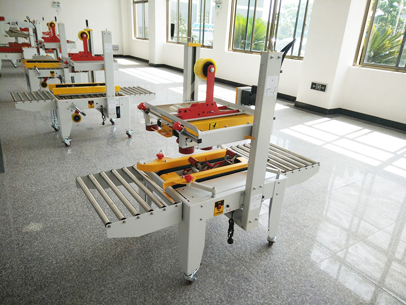 JS-FX500C 上(shang)下驅動手動折蓋(gài)膠帶封箱機